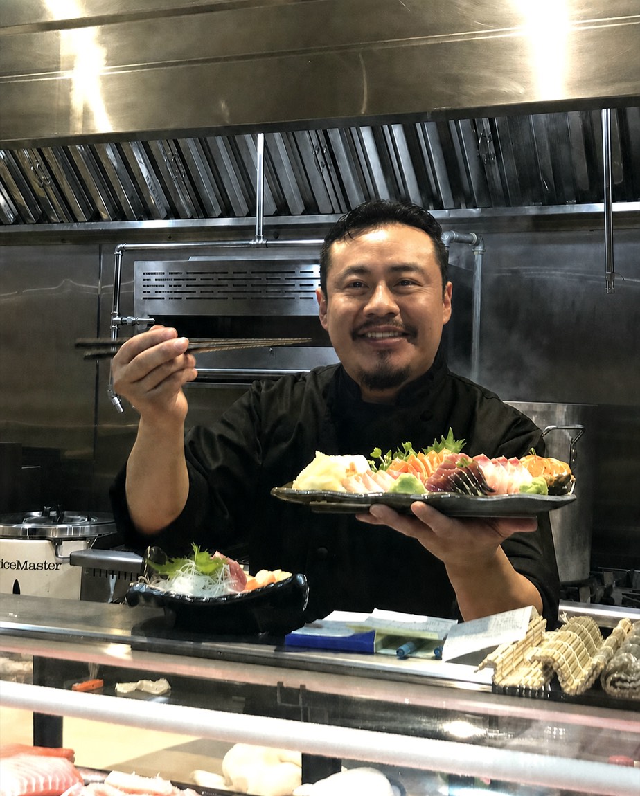 Chef Julio Zapata presenting a sashimi platter